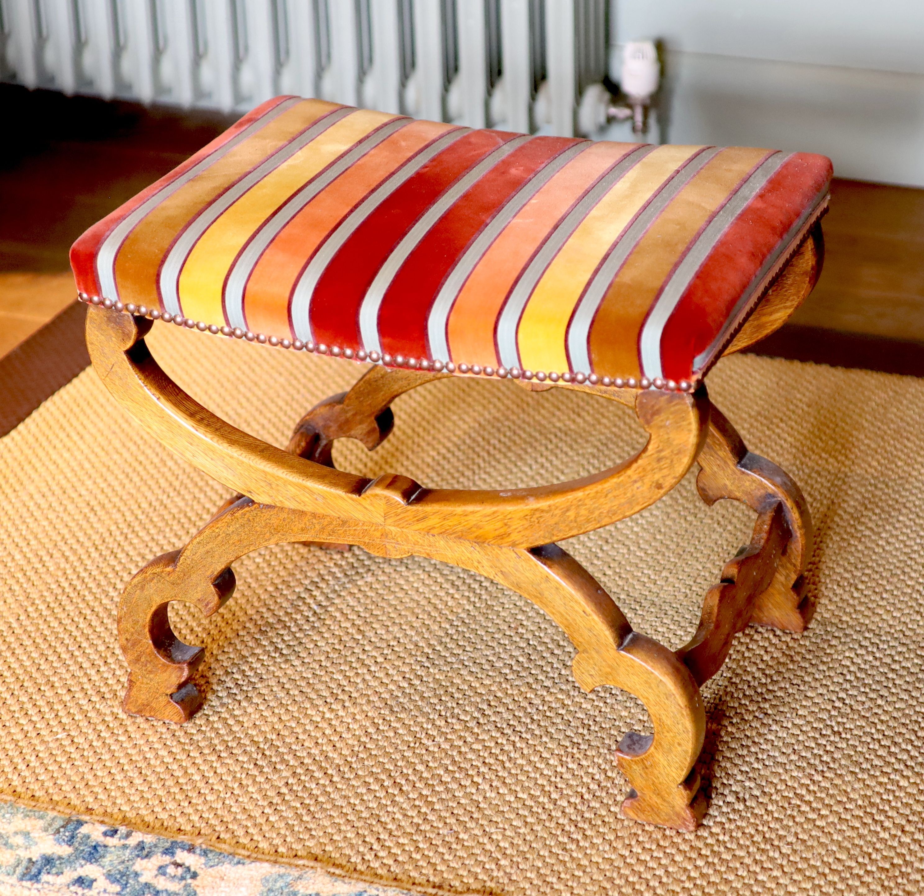 A Victorian X frame oak foot stool, with striped fabric upholstery, 54 x 40cm height 45cm